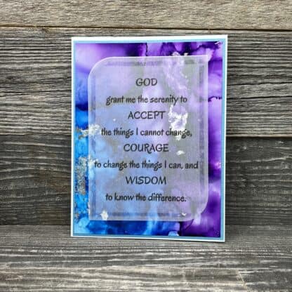 Inspirational serenity prayer card with purple and blue watercolor background.