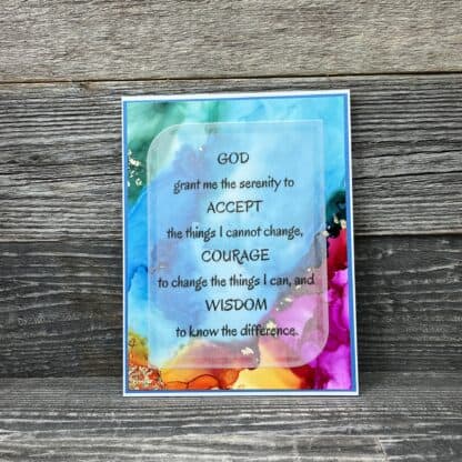 Inspirational recovery card with a calming watercolor background and a prayer for serenity and coura.