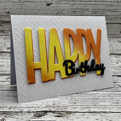 Colorful handmade birthday greeting card with layered 'happy' and 'birthday' text for special occasions.