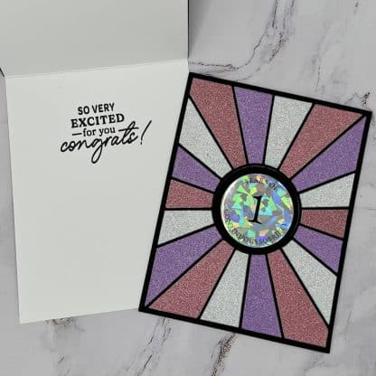 Holographic center with "1 year of continuous sobriety and the inside sentiment, "so very excited for you congrats! "