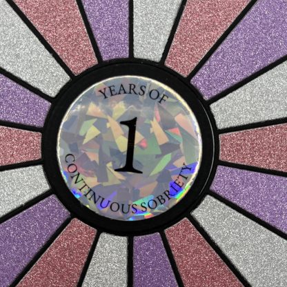 Colorful glitter recovery affirmation card with "one year of continuous sobriety" message.