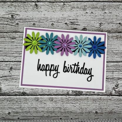 Bright handmade birthday card with floral accents, perfect for recovery-themed celebrations.