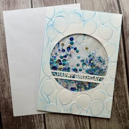 Happy birthday balloons shaker card with glitter.