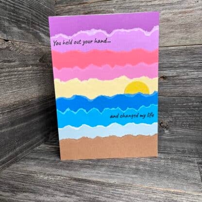 Colorful handmade recovery card with sunset and uplifting message.