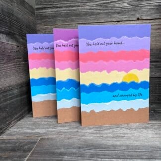 Colorful handmade recovery cards with sunset and uplifting message.