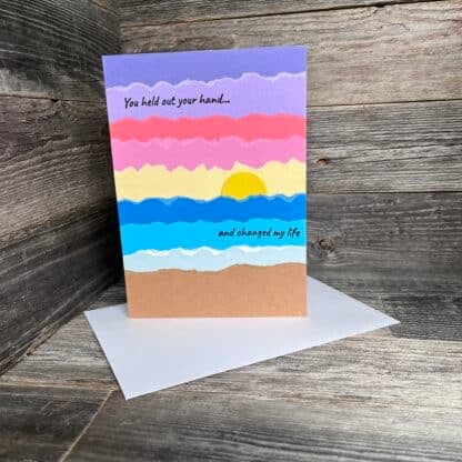 Handmade recovery card with colorful sunset and uplifting message.