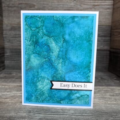 Blue textured handmade recovery card with 'easy does it' slogan.