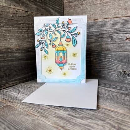 Colorful handmade recovery card with lantern and floral design, follow your dreams message.