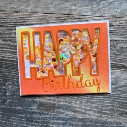 Colorful birthday card with confetti and orange outline text.