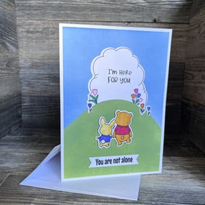 Cute handmade recovery card with bunny and bear holding hands in nature.